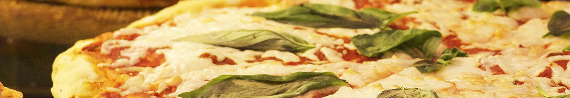 Eating Italian Pizza at Sicilian Delight restaurant in New Hartford, NY.